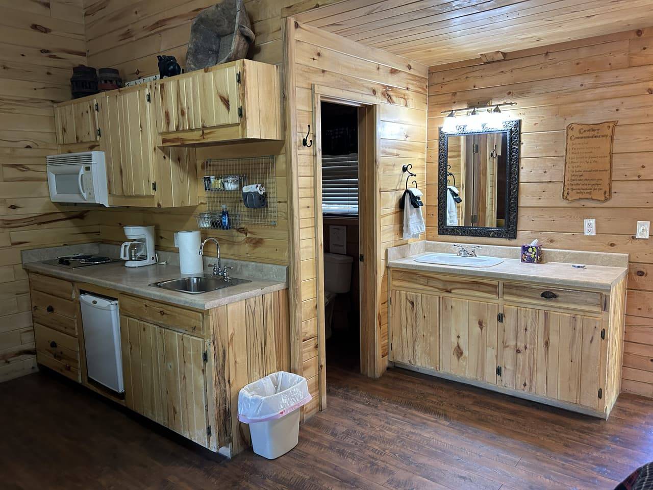 Sabinal King Suite kitchenette and bathroom vanity combination with knotty pine cabinets